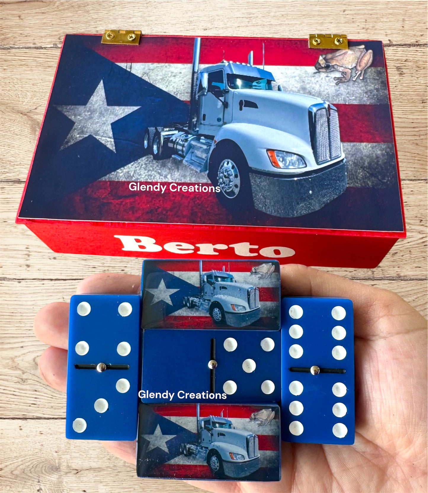 Double 6 dominoes with the flag of Puerto Rico with a truck in the background